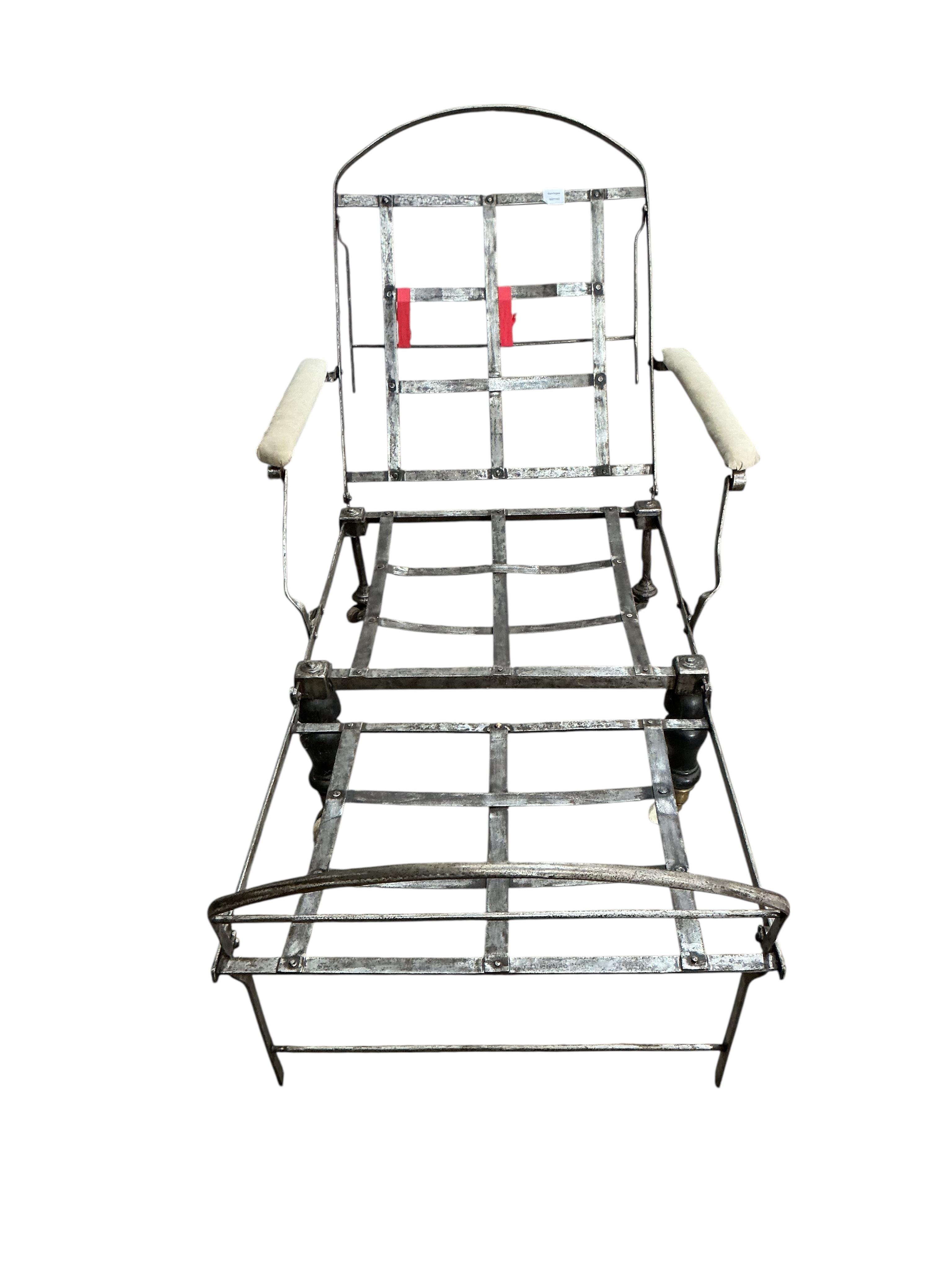 A 19th century wrought iron folding campaign day bed